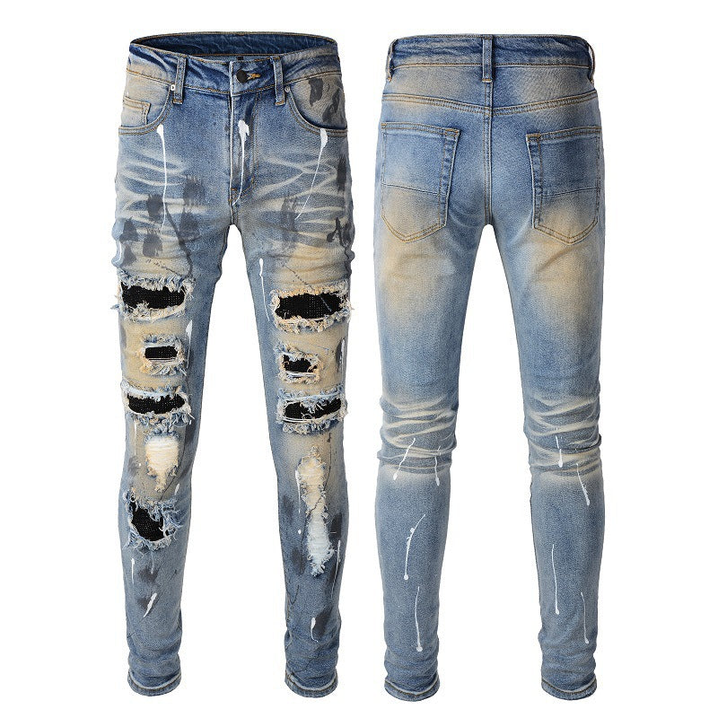 Men's Blue Jeans with Black Patches, Distressed Paint, and Ripped Details 523