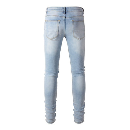 1307 European and American High Street Jeans Sticker Hand worn Ripped Jeans Slim fitting and Thin Small Feet Jeans